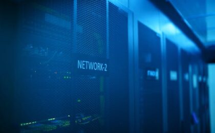 A modern server room featuring network equipment with blue illumination. Ideal for technology themes.